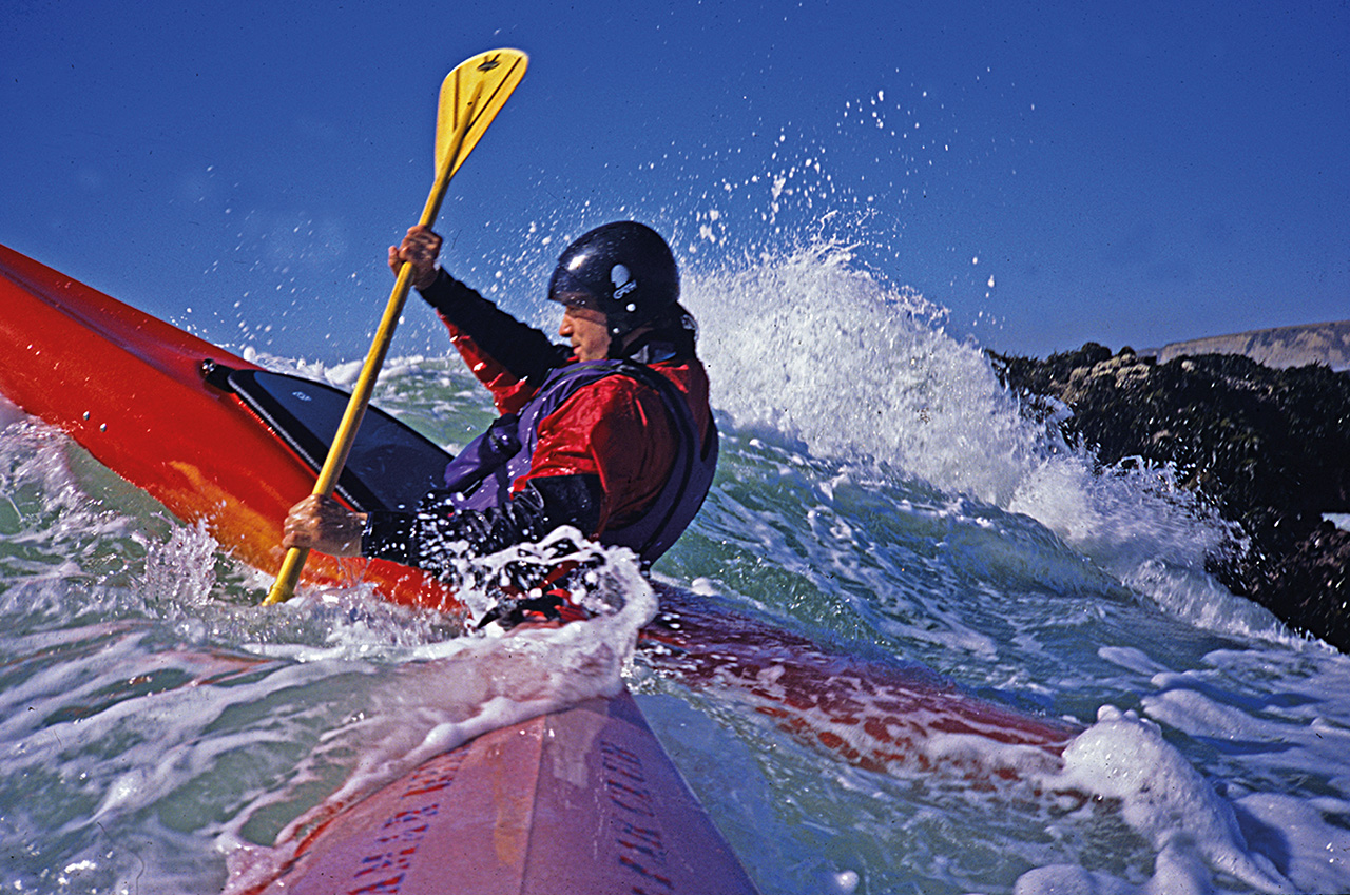 Kayaker Breaking Surf