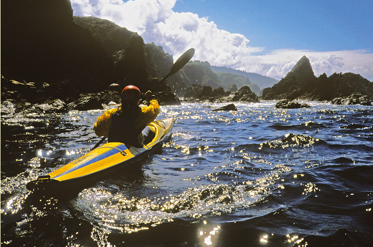 Kayaker Rocky Coast
