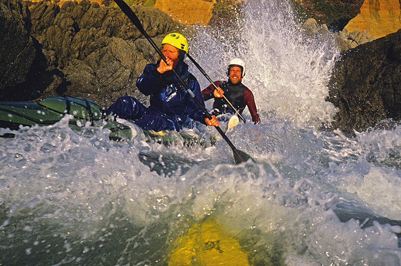 Kayakers Cliff Water
