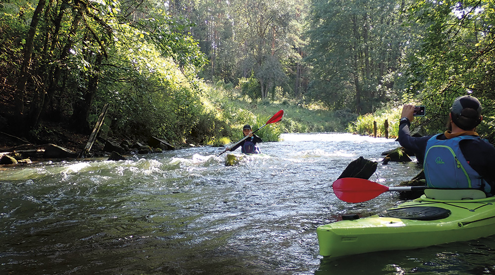 Dasha paddling down the rapid at Zervynos