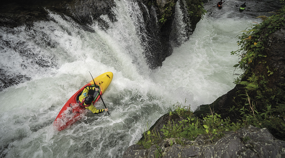 Riding the curtain on Pezma drop, Big Banana Gorge